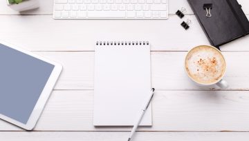 Workspace with computer and diary