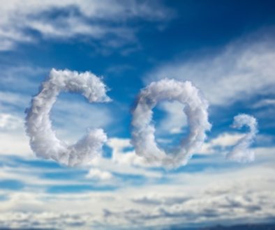 Cloud CO2 symbol on blue sky background. Planet pollution, smog concept. 3d illustration